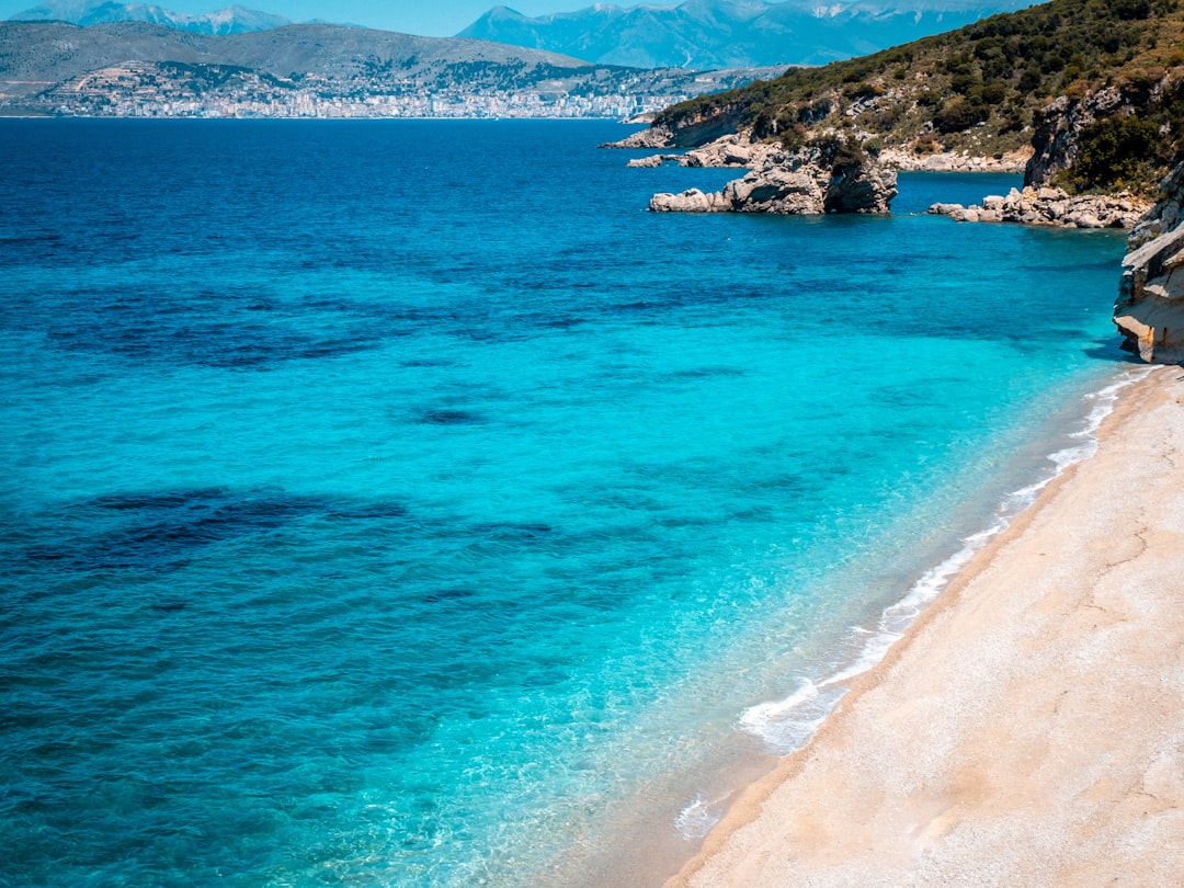a-beautiful-beach-with-crystal-clear-blue-water-Hf6aNLpAdRY.jpg
